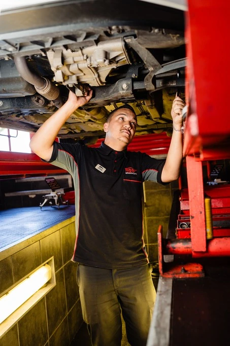 Free vehicle safety check A Tiger Wheel & Tyre mechanic performing a free vehicle safety check