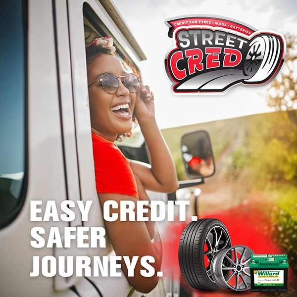 StreetCred Financing - A family of 3 driving in a car smiling and laughing